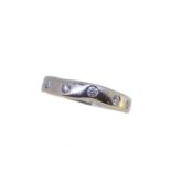 An 18ct gold diamond set band,