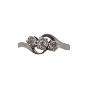 A three stone diamond crossover ring,