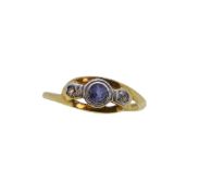 An 18ct gold sapphire and diamond three stone crossover ring,
