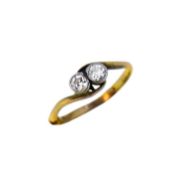 A two stone diamond crossover ring,