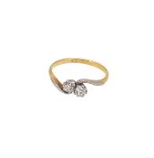 A two stone old mine cut diamond crossover ring,