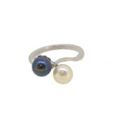 A mid 20th century 'night and day' pearl crossover ring,