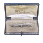 A cased single stone diamond bar brooch,