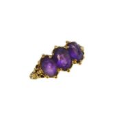 A 9ct gold three stone amethyst ring,