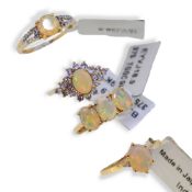 Four 9ct gold opal Gemporia rings, together with a pair of opal earrings,