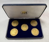 Royal Mint for Hampton & Sons - A set of five silver gilt celebratory medals,