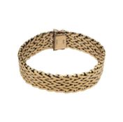 A late 20th century 9ct gold wide bracelet,