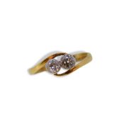 A two stone diamond crossover ring,