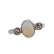 A three stone opal and diamond ring,