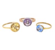 A trio of gemset dress rings,