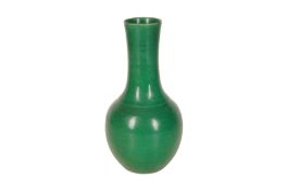 A CHINESE MONOCHROME APPLE-GREEN VASE
