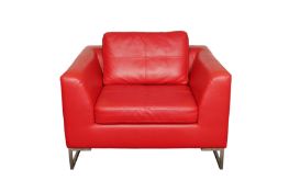A CONTEMPORARY RED LEATHER ARMCHAIR BY DWELL