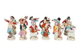 A SET OF TWELVE DRESDEN PORCELAIN MONKEY BAND FIGURES