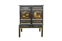 A BLACK LACQUERED LATE QING DYNASTY CHINESE CABINET ON STAND