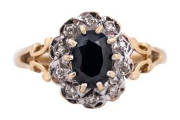 A SAPPHIRE AND DIAMOND HALO RING, CIRCA 1988