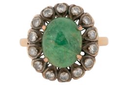 AN EMERALD AND DIAMOND CLUSTER RING