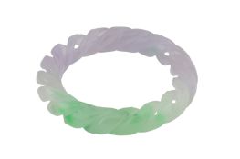 A CARVED JADE BANGLE