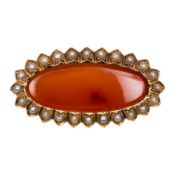 A carnelian and seed pearl brooch