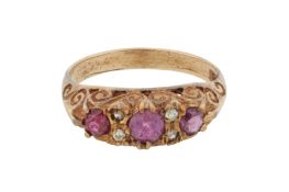 A ruby and diamond three stone ring