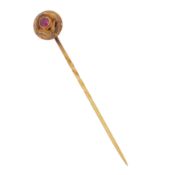 A gem set pin brooch