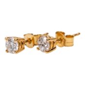 A pair of diamond stud earrings
