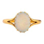 An opal single stone ring