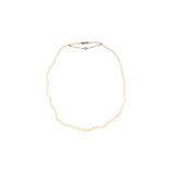 A pearl necklace with a Mikimoto original case
