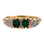 An emerald and diamond ring