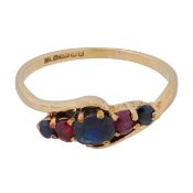 A sapphire and ruby cross-over ring