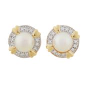A pair of pearl and diamond stud earrings