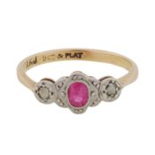 A ruby and diamond three stone ring