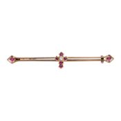 A ruby and diamond cross brooch