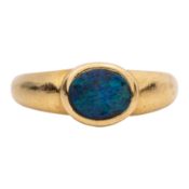 An opal single stone ring