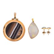 An opal pendant and earrings suite with an agate pendant