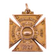 A Maltese cross pendant