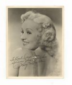Grable (Betty) Black and white studio photograph of Betty Grable in a head and shoulders, smiling po
