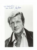 Moore (Roger) Glossy black and white photograph of Roger Moore in a head and shoulders pose, signed 