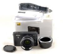 Black Nikon J1 Mirrorless Digital Compact Camera.