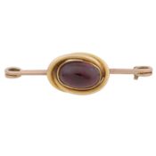 A garnet pin brooch