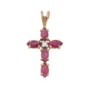 A ruby and diamond cross pendant