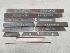 A collection of W. H. Smith in-store category signs in relief