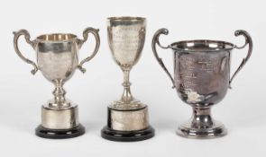 Three silver trophy cups