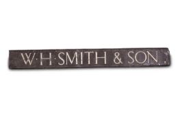 A large brown painted lead store or shop sign for W. H. Smith & Son