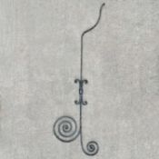 A large black painted wrought iron bracket