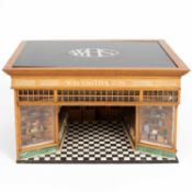 An oak and painted model of a W. H. Smith high street store