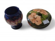 A Moorcroft vase with autumn leaf and berry tubeli
