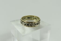 An unmarked full eternity ring set with blue and w