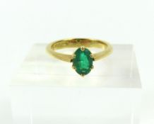 An 18ct gold emerald single stone ring, the oval c