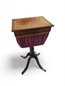 A 19th century mahogany sewing table with rose bag