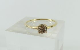 A 9ct gold champagne diamond solitaire ring, finge